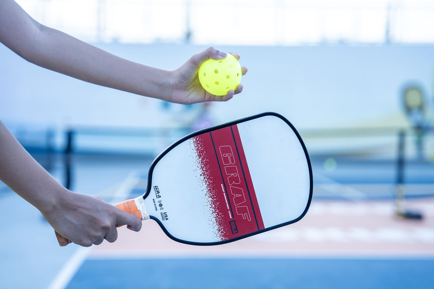 Paddle and ball ready for the serve